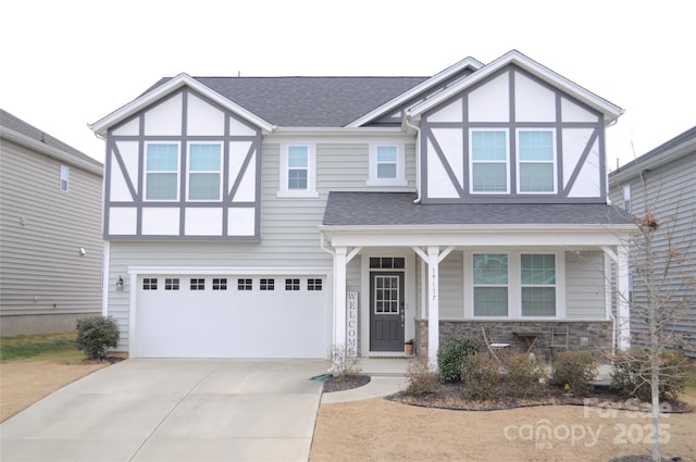 tudor-style house featuring a garage