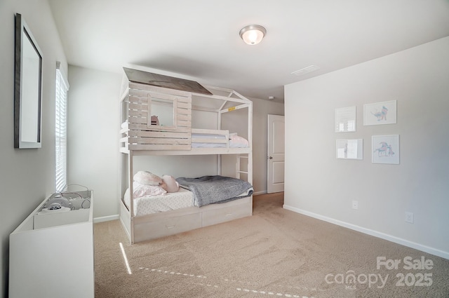 carpeted bedroom featuring baseboards