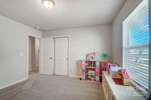 game room with carpet flooring and baseboards