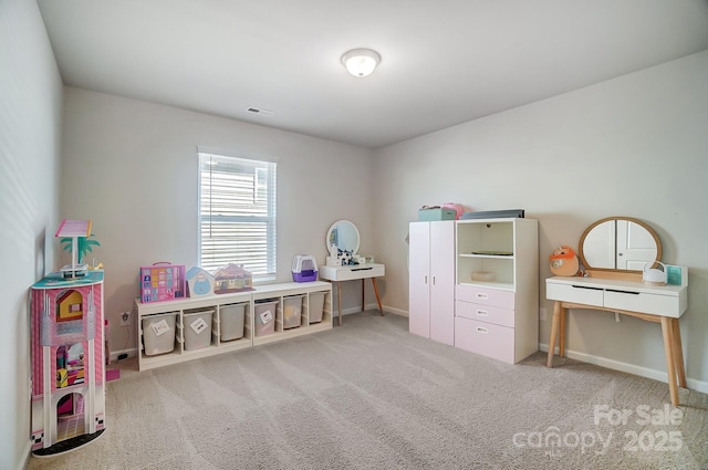 recreation room featuring light carpet