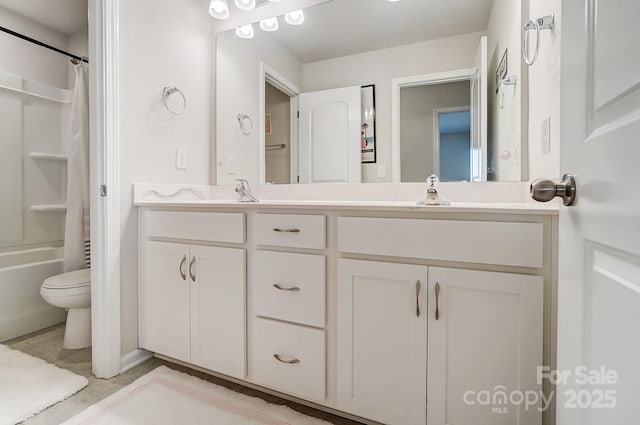 full bathroom with shower / bath combination with curtain, vanity, and toilet