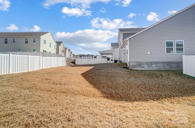 view of yard with a fenced backyard