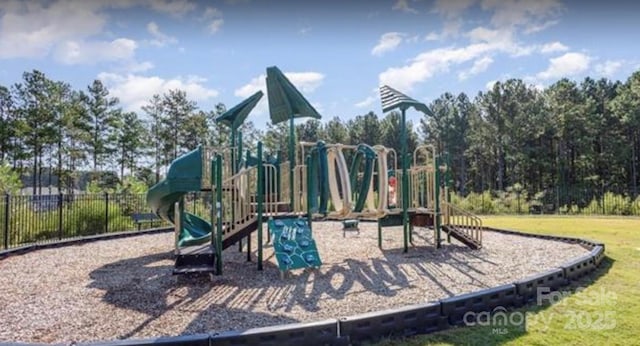 communal playground featuring fence