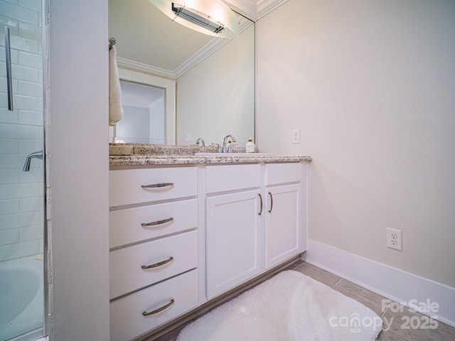 bathroom featuring tile patterned floors, vanity, and ornamental molding