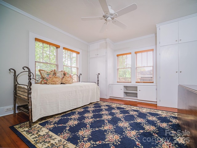 bedroom with ceiling fan, hardwood / wood-style flooring, and crown molding