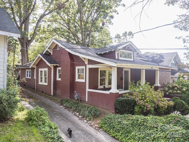 view of property exterior featuring covered porch