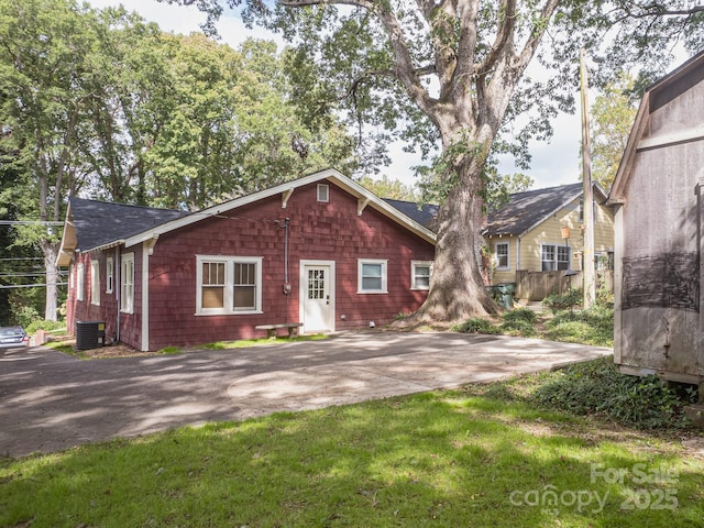 view of front of property featuring central air condition unit and a patio area