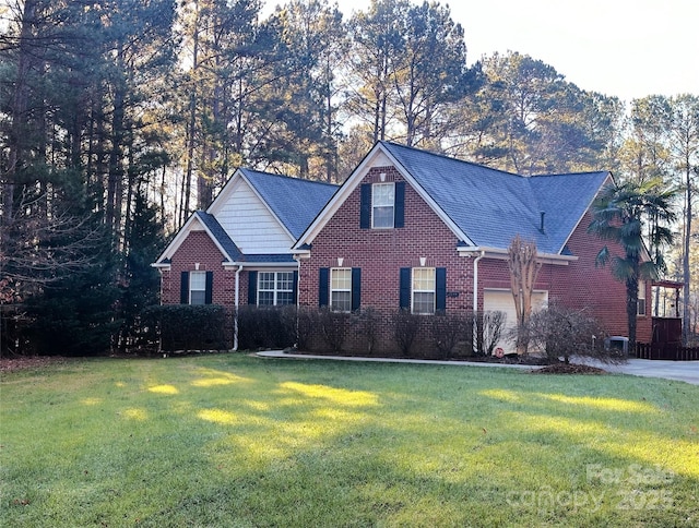 front of property featuring a garage and a front lawn