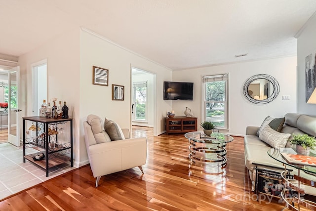 4145 Wall St, Charlotte, NC 28209 - living area featuring wood finished floors, ornamental molding, and baseboards