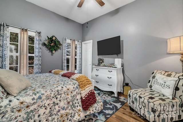 bedroom with hardwood / wood-style flooring and ceiling fan