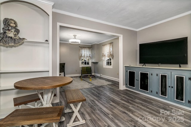 dining room with dark wood-type flooring and ornamental molding