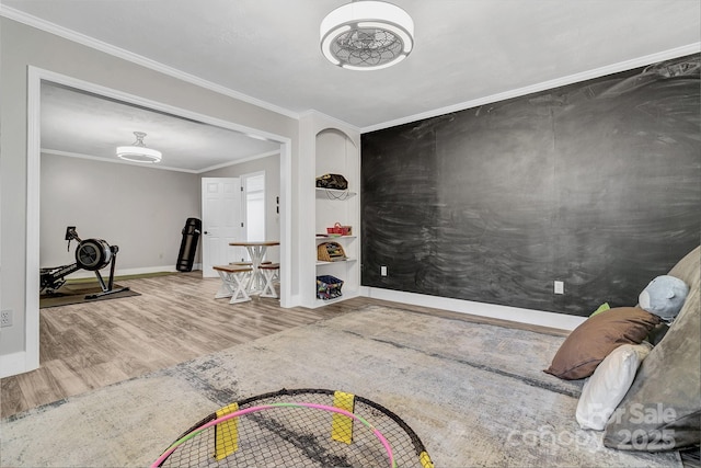 entryway featuring wood-type flooring and ornamental molding