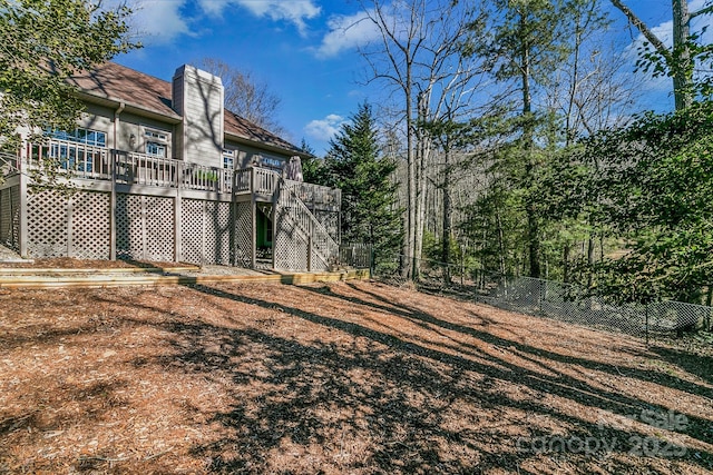 view of yard with a wooden deck