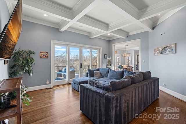 living room featuring french doors, coffered ceiling, ornamental molding, dark hardwood / wood-style floors, and beamed ceiling