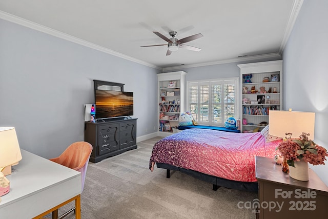 carpeted bedroom with ornamental molding and ceiling fan