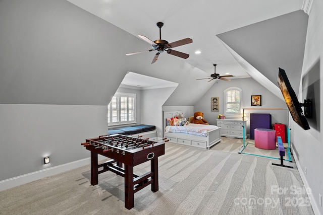 recreation room with plenty of natural light, light carpet, and lofted ceiling