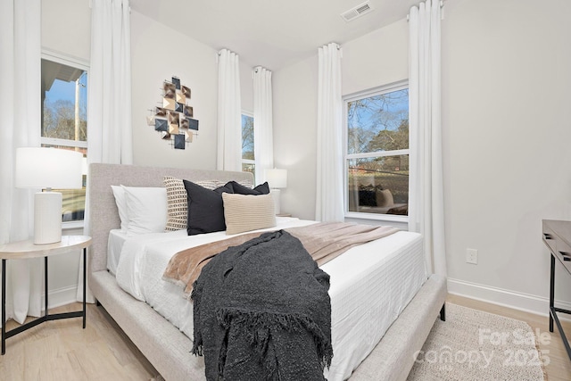 bedroom with light hardwood / wood-style floors