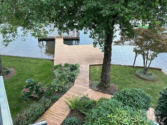 view of dock featuring a water view and a lawn