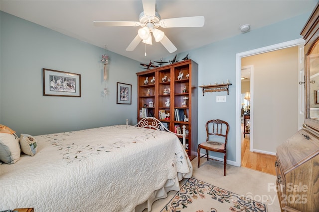 carpeted bedroom featuring ceiling fan