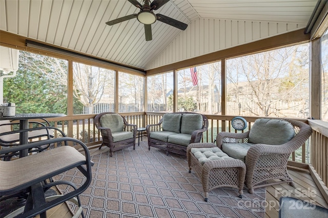 sunroom featuring ceiling fan, plenty of natural light, and lofted ceiling