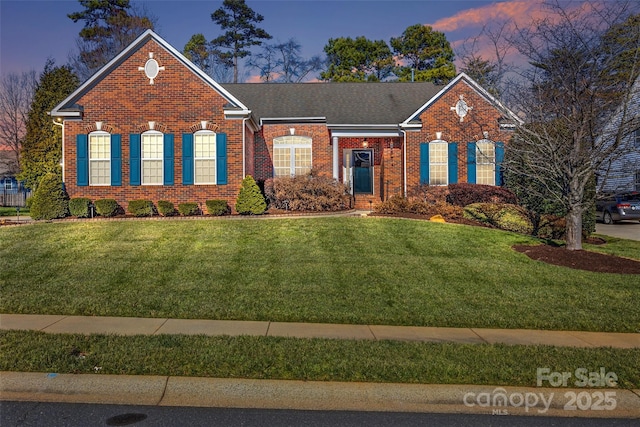 view of front of home featuring a yard