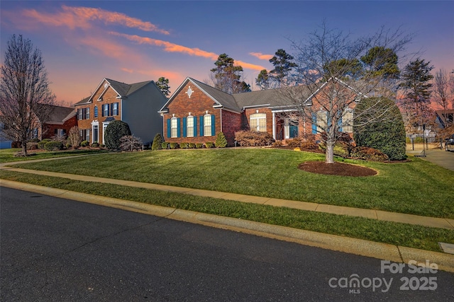 view of front of home with a lawn