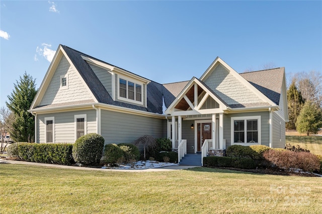 craftsman-style home featuring a front lawn