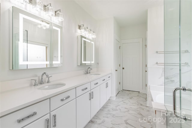 bathroom featuring vanity and shower with separate bathtub