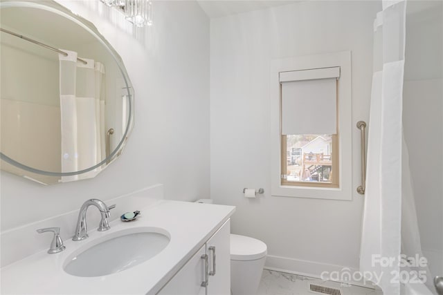 bathroom with vanity and toilet