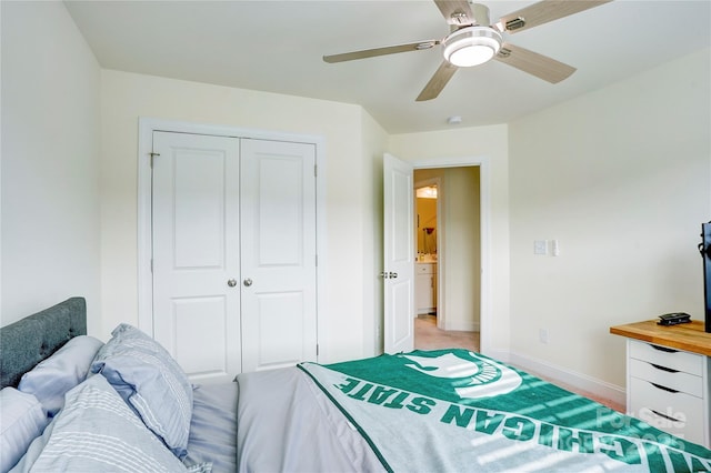 bedroom featuring ceiling fan and a closet