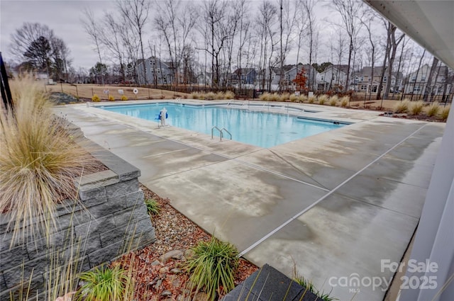 view of pool featuring a patio