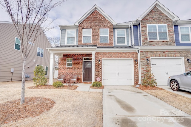 townhome / multi-family property featuring a porch and a garage