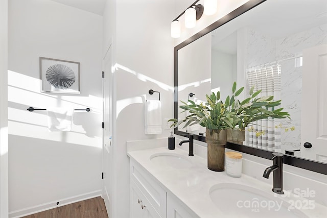 bathroom with vanity and hardwood / wood-style floors