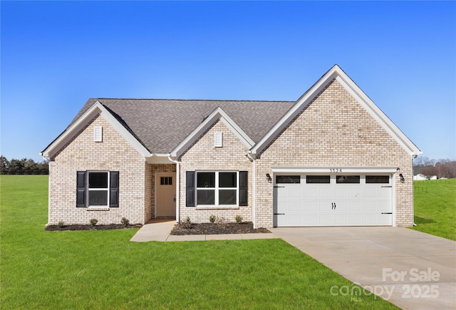 view of front facade with a garage and a front lawn