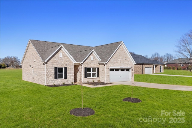 view of front of house featuring a garage and a front lawn