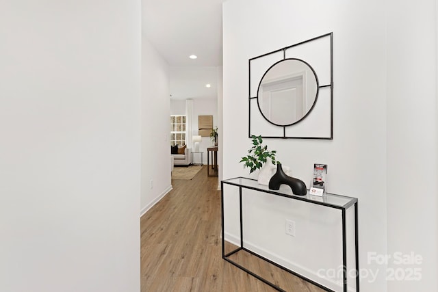 hall with light hardwood / wood-style flooring