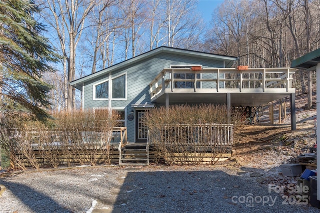 view of front facade featuring a wooden deck