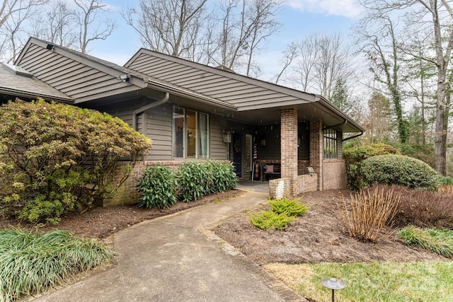 view of side of property with brick siding