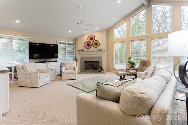 living room with carpet floors, a fireplace with flush hearth, ceiling fan, and recessed lighting