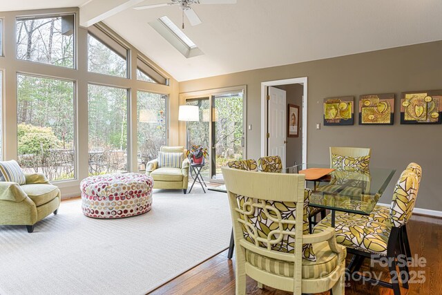 dining room featuring a ceiling fan, a wealth of natural light, and wood finished floors