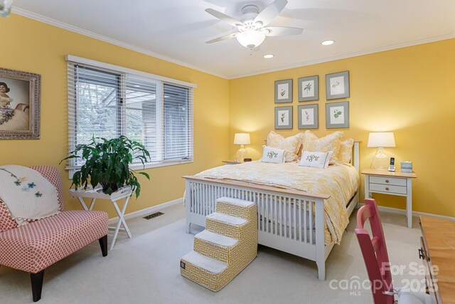 carpeted bedroom with baseboards, ornamental molding, visible vents, and recessed lighting