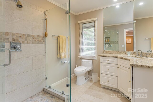 full bath with vanity, ornamental molding, toilet, and a shower stall