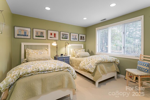 carpeted bedroom featuring recessed lighting, baseboards, and visible vents