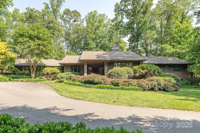 14 Stuyvesant Cres, Asheville, NC 28803 - view of front facade with a front yard and a chimney