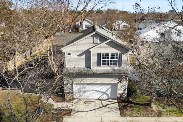 view of side of home with a garage