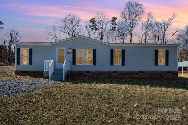 view of front of home with a yard