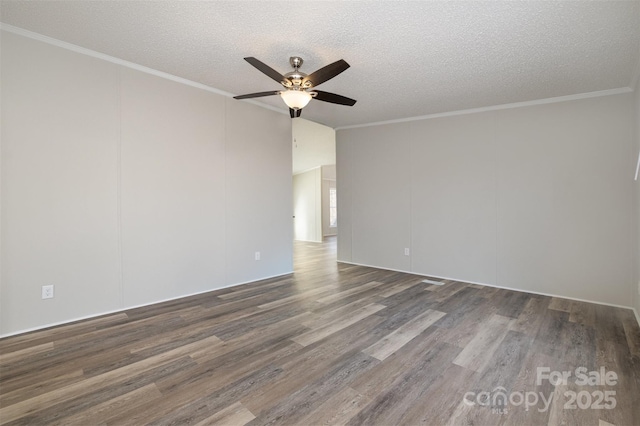 empty room featuring ceiling fan, dark wood-type flooring, a textured ceiling, and crown molding