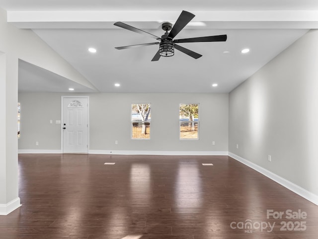 unfurnished room with lofted ceiling with beams, ceiling fan, and dark hardwood / wood-style flooring