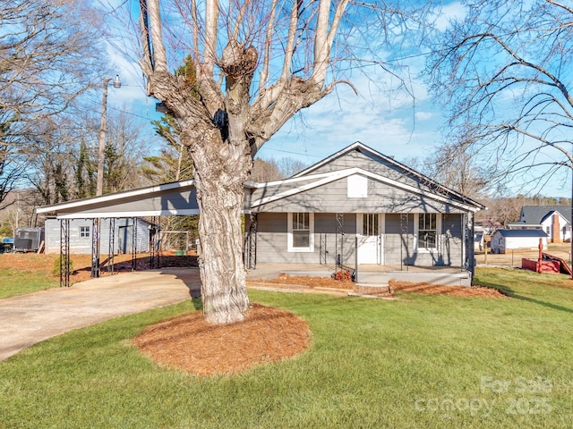 view of front facade with a carport and a front lawn