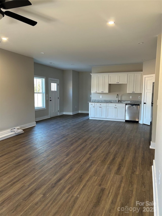 kitchen with white cabinetry, ceiling fan, dark hardwood / wood-style flooring, stainless steel dishwasher, and sink